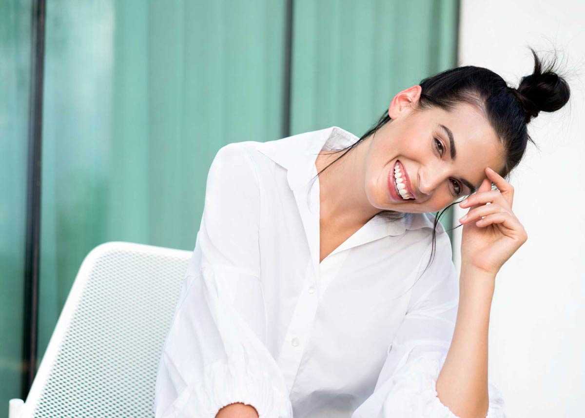 a woman with a fresh face smiling