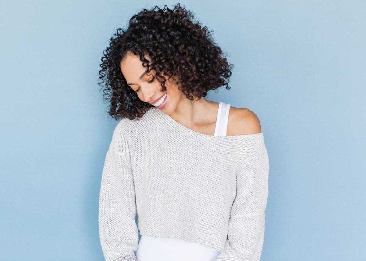 woman looking down and smiling